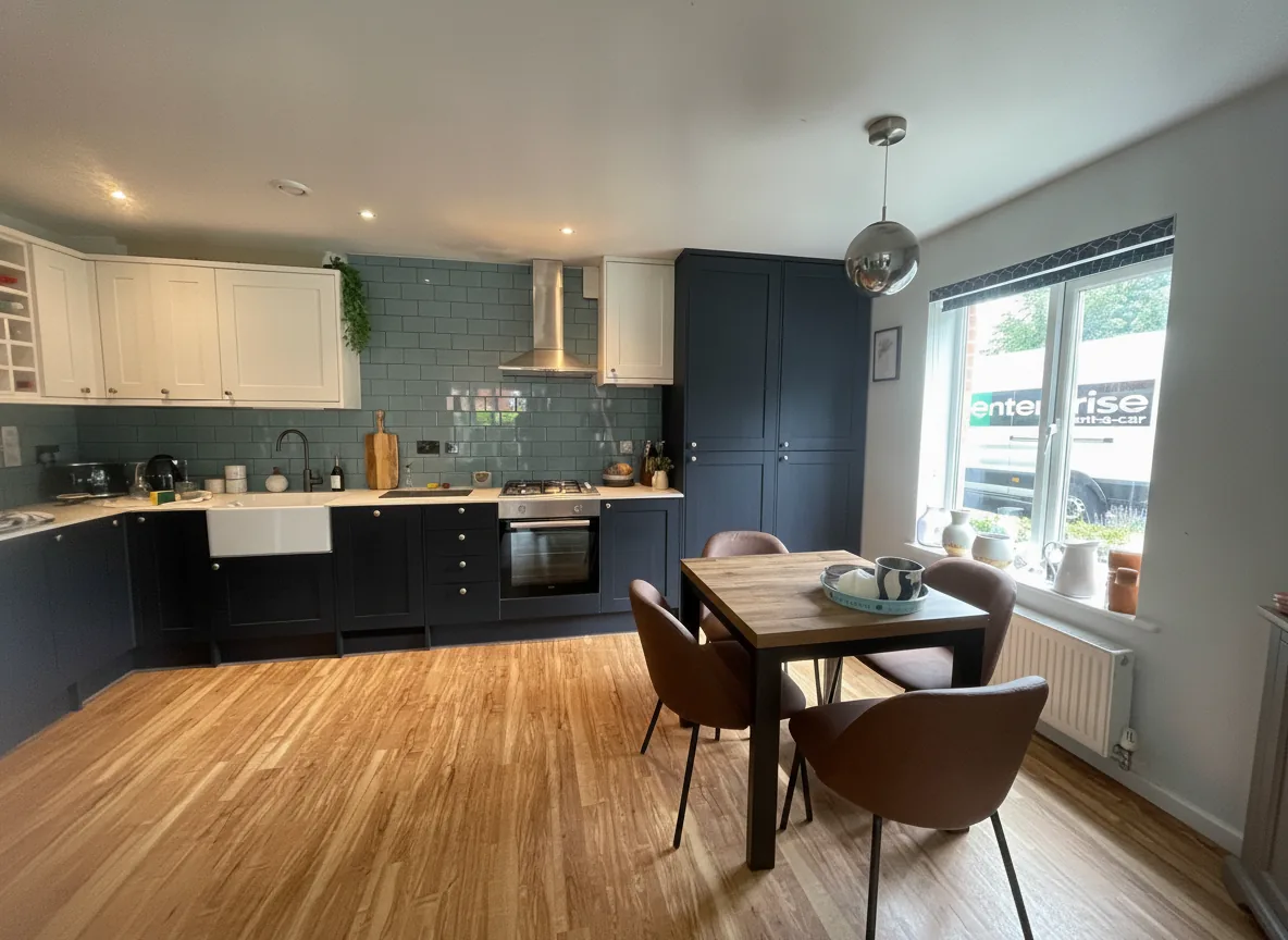 Navy and white shaker kitchen with butler sink, teal metro tiles and gas hob installation, North London